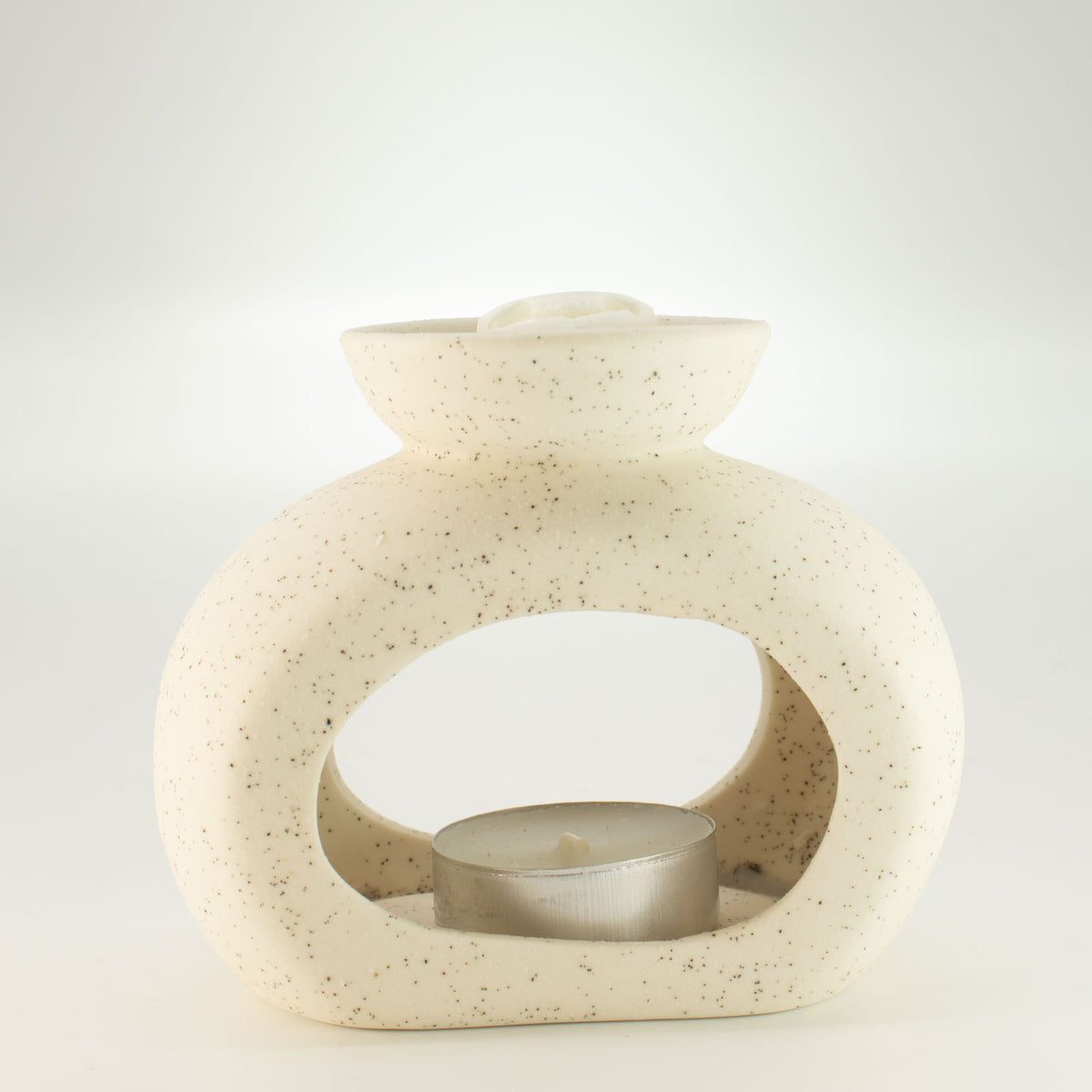 Pebble wax burner with a tealight inside and a wax melt cube in the dish