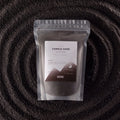 Spirited fragranced candle sand in black