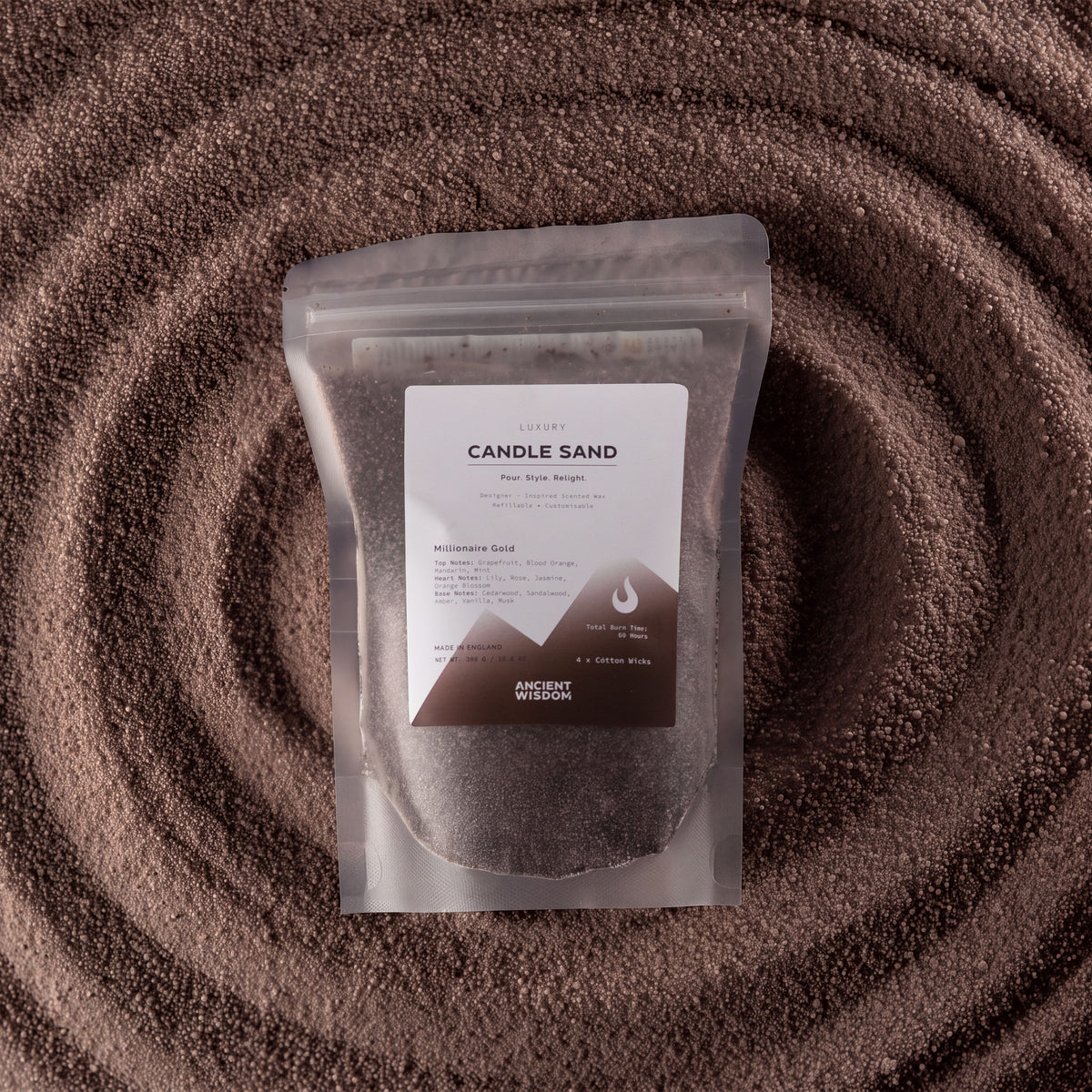 Millionaire Gold fragranced candle sand in chocolate brown