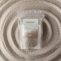 Starlight Elixir fragranced candle sand in white